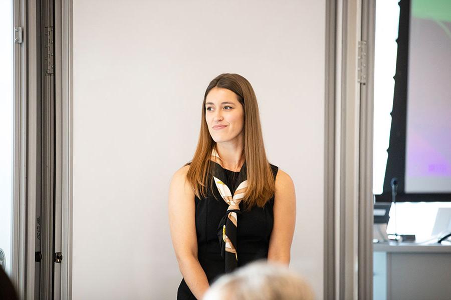 woman making her leadership presentation in a classroom