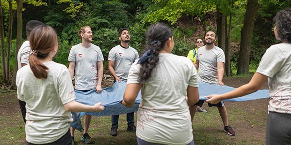 MBA Students with parachute cloth at BaseCamp