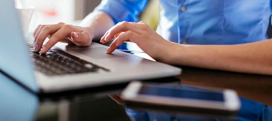 Female hands on a keyboard